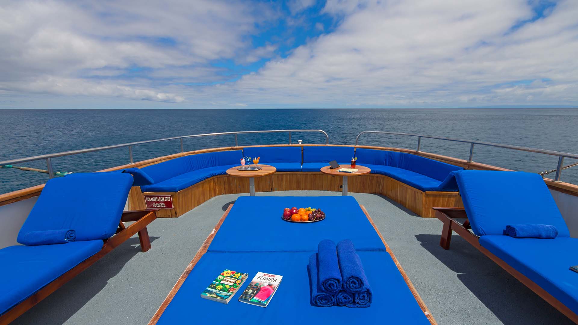 Relax in the sun on the deck as you sail on the Beluga Yacht, Galapagos Islands, Ecuador
