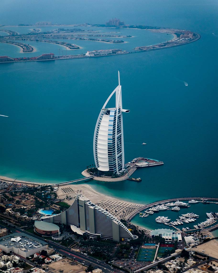 UAE_BurjAlArabDubai_912x1140 The iconic Burj Al Arab sits in the foreground of the Palm Jumeirah, itself a marvel of Dubai, United Arab Emirates